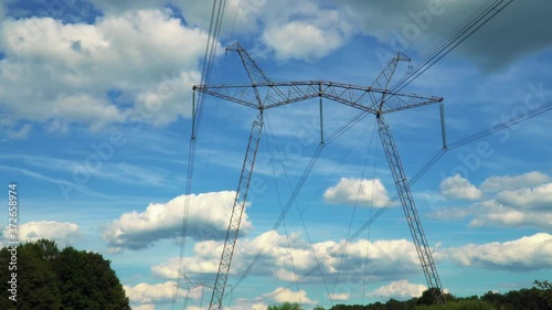 The 750 kV line support is a power distribution and transmission unit to the consumer. A large electric support stands on the sky background photo