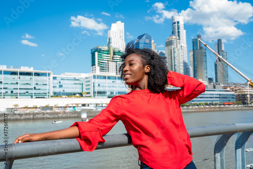 A happy black woman enjoying in the city
