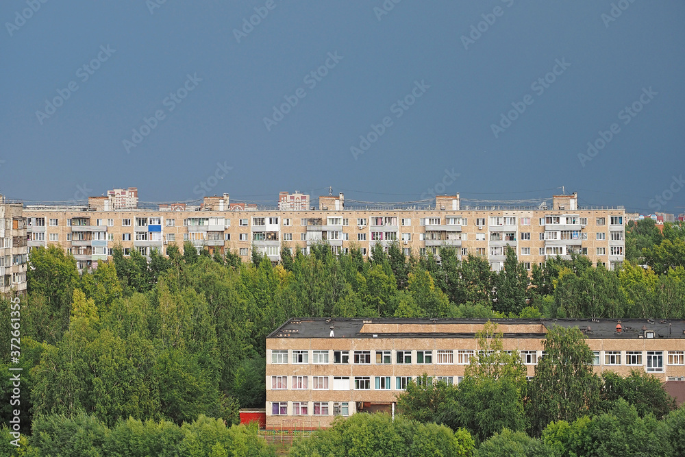 Brick multi-building residential house, urban background, wall with windows