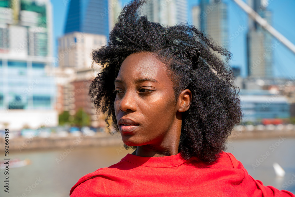 A happy black woman enjoying in the city A happy black woman enjoying in the city