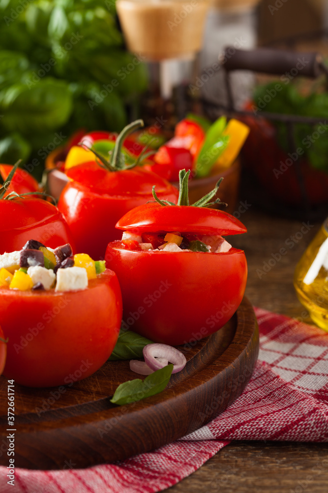 Greek stuffed tomato with feta cheese, olives, and fresh pepper. Greek stuffed tomato with feta cheese, olives, and fresh pepper.
