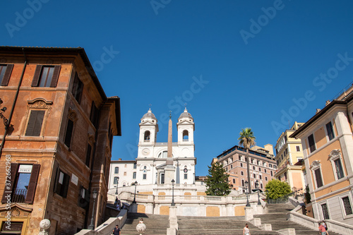Trinità dei Monti Church on top of Spanish Steps in Rome Italy. With 138 steps in total the Spanish Steps of Rome are the longest and widest outdoor steps in Europe. © lucazzitto