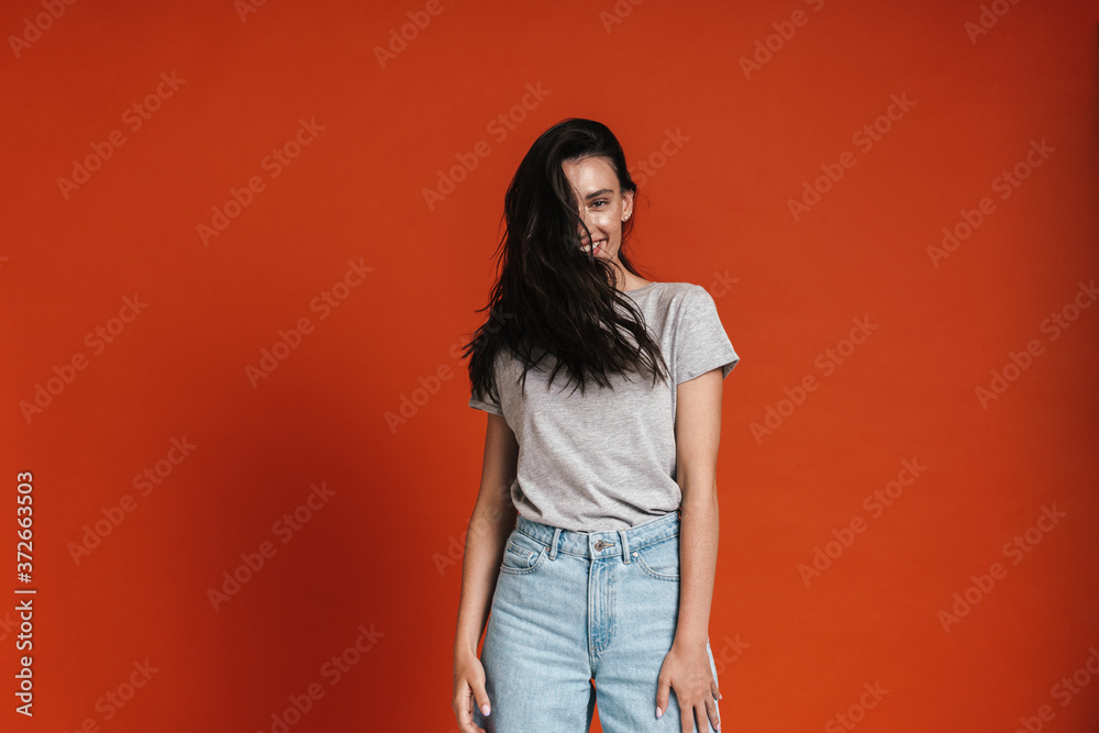 Image of beautiful happy woman smiling and shaking her hair