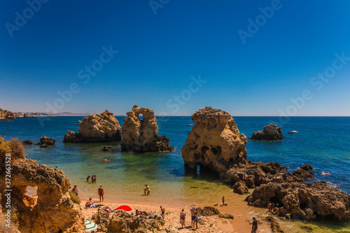 Beautiful hidden beach with beautiful blue water (Arrifes in Algarve, Portugal) photo