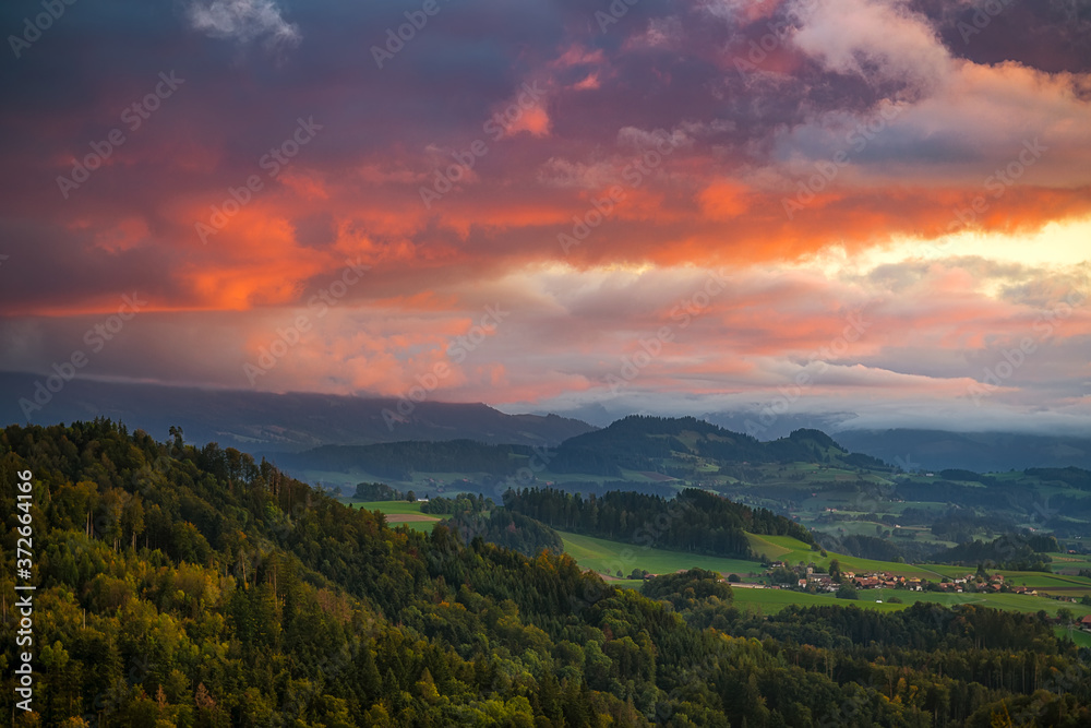 Bern during sunset with colorful sky and nice cloudscape. European mountain landscape, Switzerland, Bern.