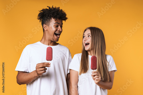 Happy young multiethnic couple with ice cream