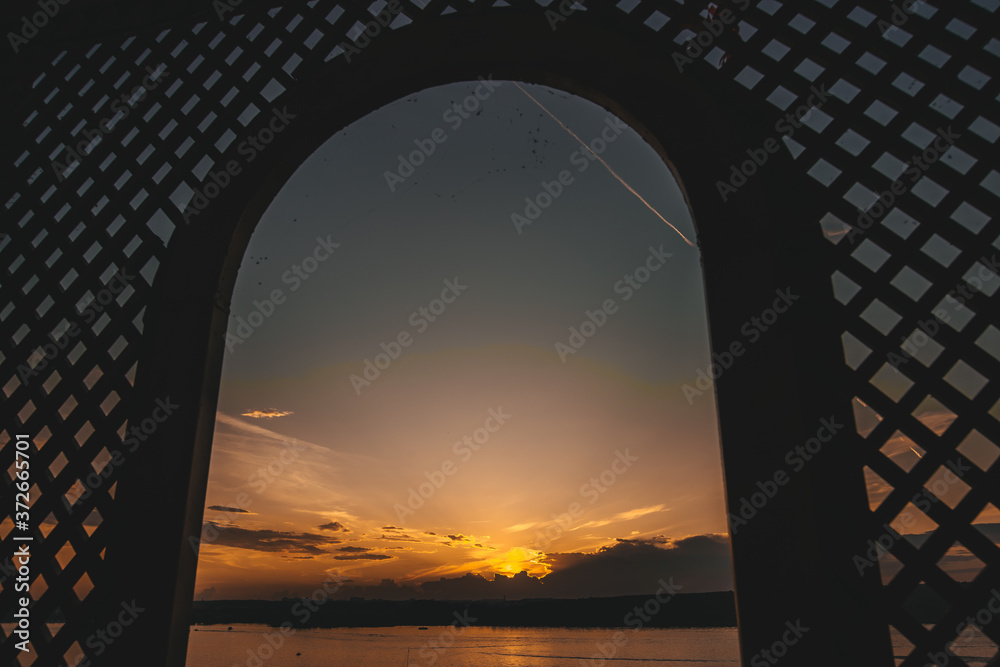 Beautiful view of the sunset in the sky from the window. Natural background.