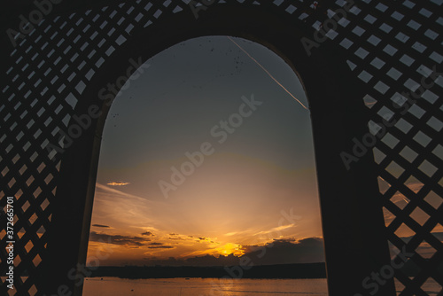 Beautiful view of the sunset in the sky from the window. Natural background.