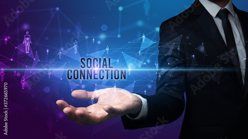 Elegant hand holding SOCIAL CONNECTION inscription, social networking concept