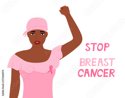 National Breast Cancer Awareness Month. African american woman was wearing a head scarf after chemotherapy and with a pink ribbon on T-shirt raised fist up.