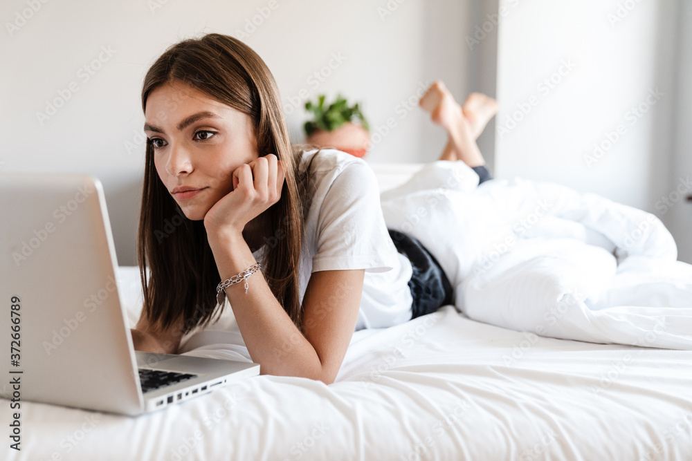 Attractive young woman using laptop computer Attractive young woman using laptop computer