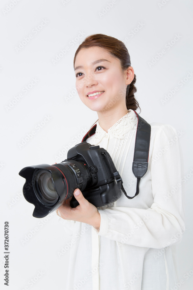 女性カメラマン