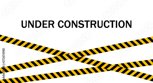 Website under construction page. Warning tape banner