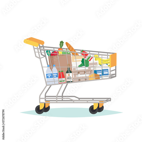 Supermarket grocery cart full of different groceries