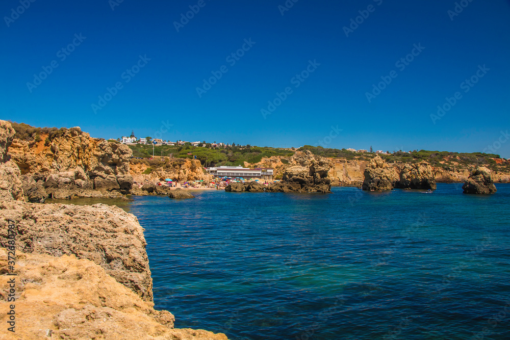 Coastline views with cliffs and small reserved  beaches in the Algarve, Portugal