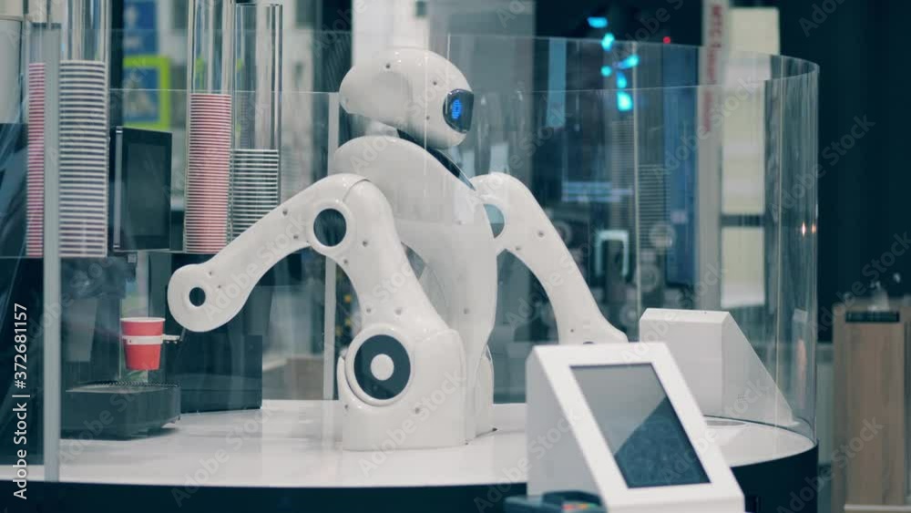 Robot is managing a machine to make coffee in a cafe