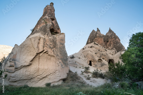 Cappadocia fairy chimneys and carved rock houses. Kapadokya is known as one of the best places to fly with hot air balloons worldwide. Goreme, Cappadocia, Turkey.