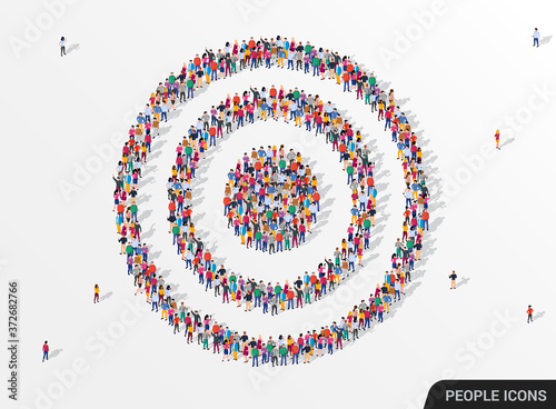 Large group of people seen from above gathered together in the shape of a target.