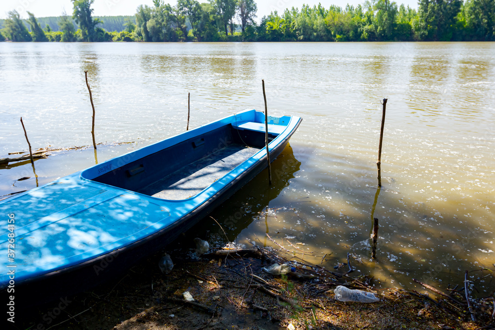 Makeshift pier on polluted river coast
