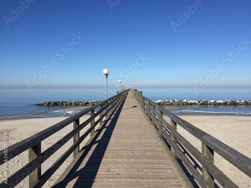 wooden pier at baltic sea in winter