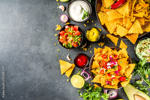 Nachos chips with dips photo