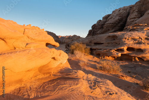Rocks and sand in the Wadi Rum desert in Jordan at sunset