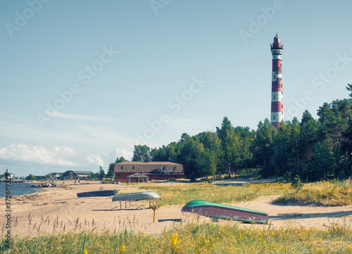 Boats on the Shore of Lake Ladoga near the Osinovetsky lighthouse on the beach in the summer in the Leningrad region photo