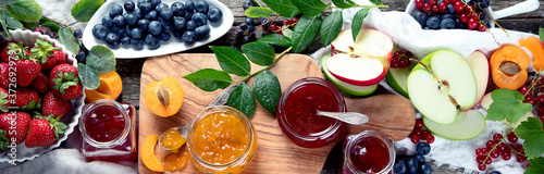 Fotografie Assortment of jams and seasonal berries, fruits