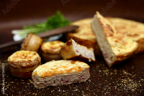 Healthy food with bread, egg, meat, vegetable on dark brown background