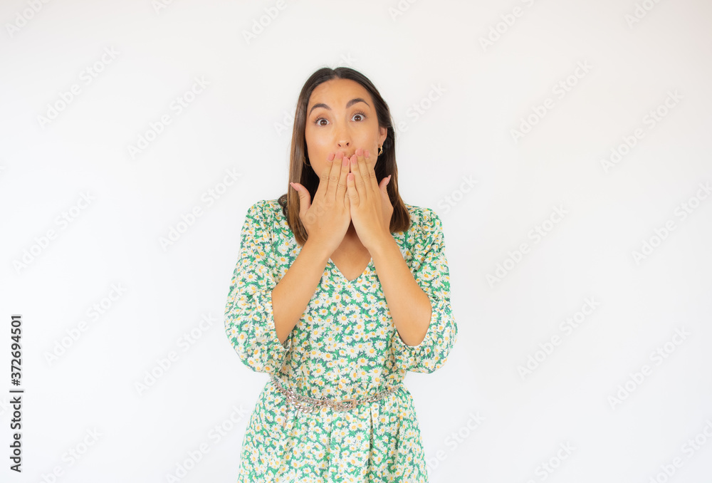 Beautiful woman in green dress gesturing on white background Beautiful woman in green dress gesturing on white background