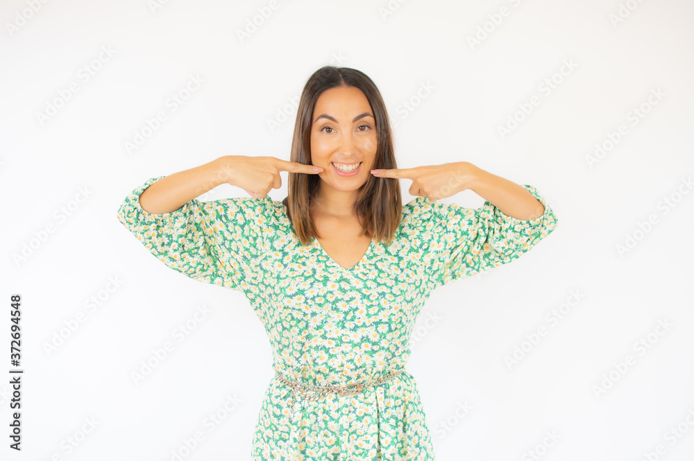 Beautiful woman in green dress smiling on white background Beautiful woman in green dress smiling on white background