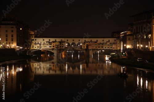 View of Ponte Vecchio bridge at night in Florence, Tuscany, Italy