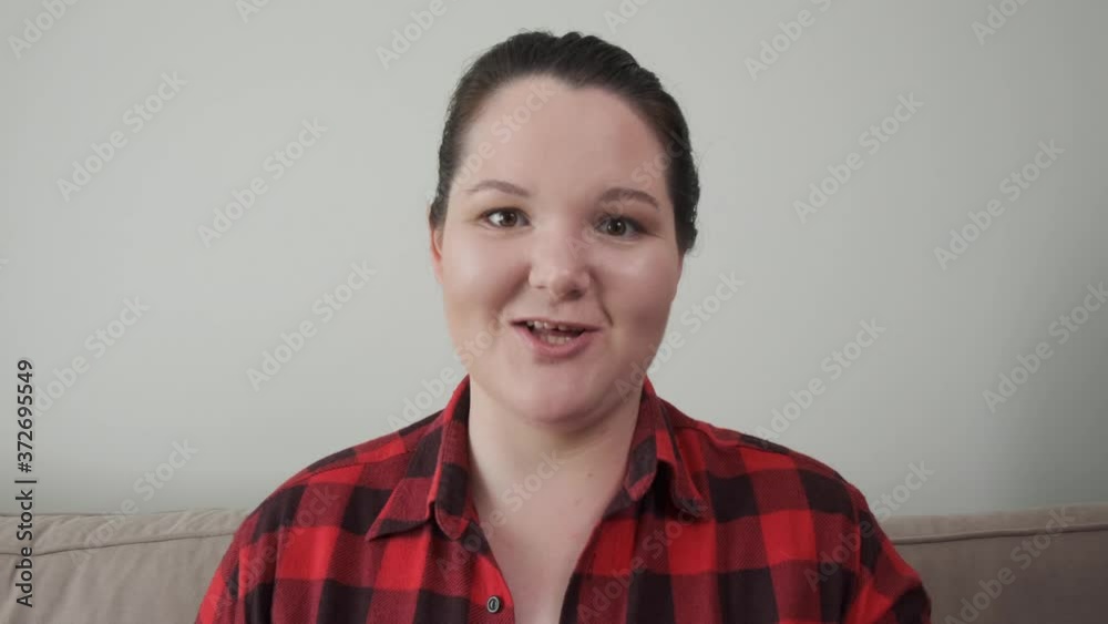 A girl with a round face swears and argues. Look into the camera. A girl with a round face swears and argues. Look into the camera.