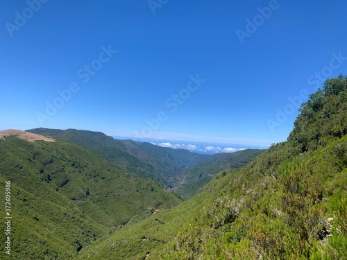 mountain landscape with blue sky, levada do alecrim in madeira island