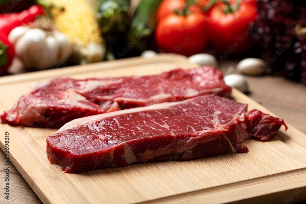 Food, meat and vegetables background. steak, fresh raw beef, background.
