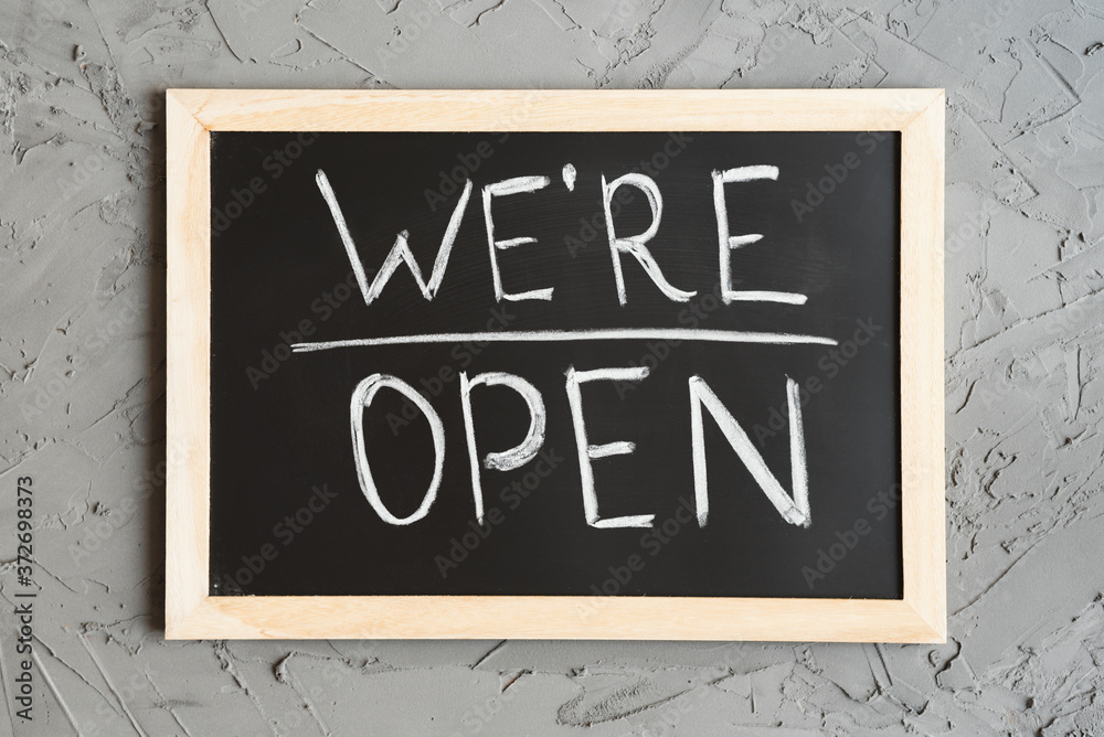 Foto de We're Open sign board for cafes and shops. Blackboard with ...