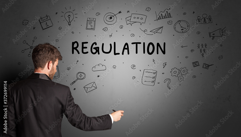businessman drawing a creative idea sketch with REGULATION inscription, business strategy concept businessman drawing a creative idea sketch with REGULATION inscription, business strategy concept