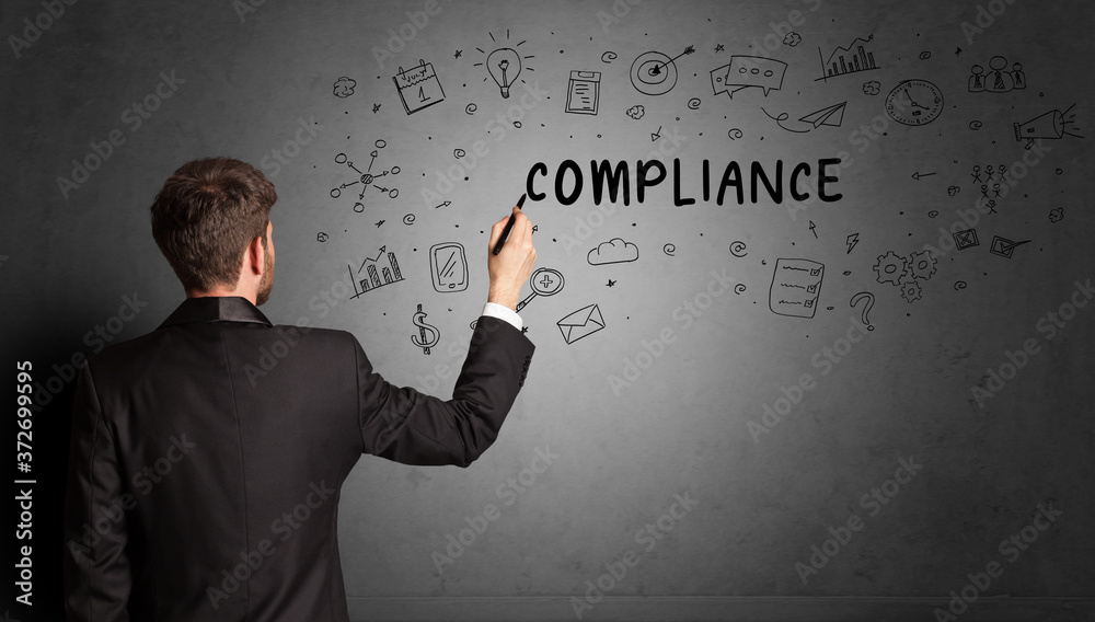 businessman drawing a creative idea sketch with COMPLIANCE inscription, business strategy concept businessman drawing a creative idea sketch with COMPLIANCE inscription, business strategy concept