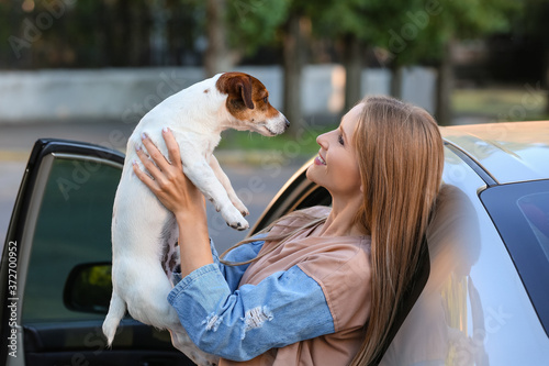 Woman with cute dog near mo...