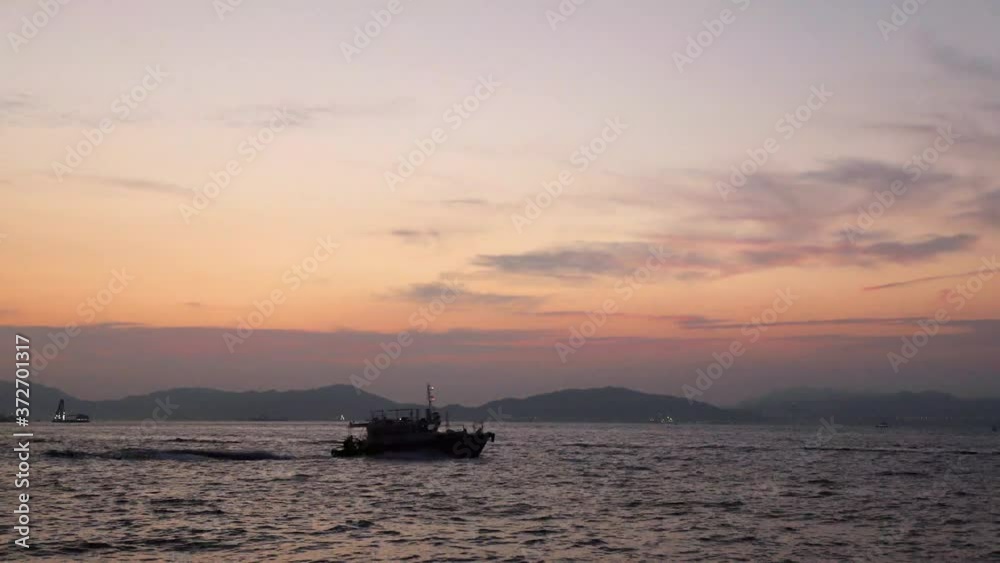 boats traveling in victoria harbour, hong kong boats traveling in victoria harbour, hong kong