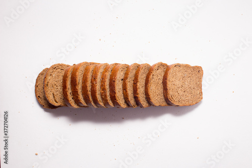 Assortment of baked bread on white background