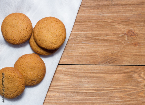 Homemade oatmeal cookie on the wooden background