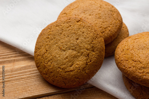 Homemade oatmeal cookie on the wooden background
