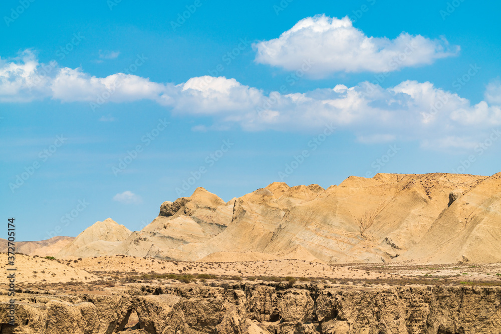 Fototapeta premium Sandy mountain peaks in the clouds