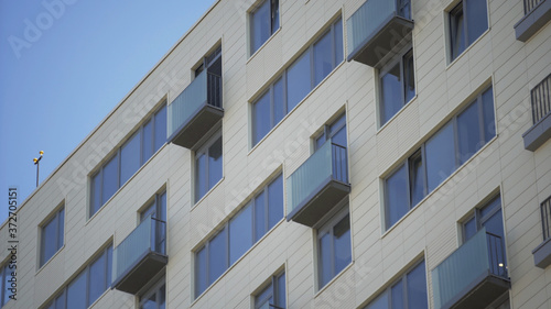 Close up shot of residential building. Close up Of An Apartment Blocks. The building features exterior with small balconies