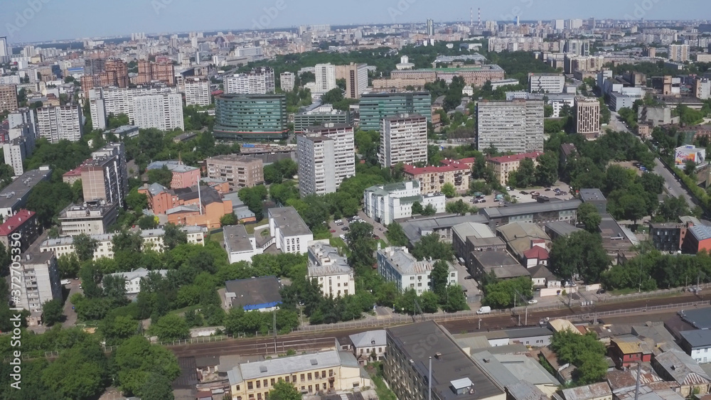 Aerial view of one of the districts of Moscow. Summer weather. Urban cityscape from quadrocopter. Development infrastructure city for big population, urban transportation system.