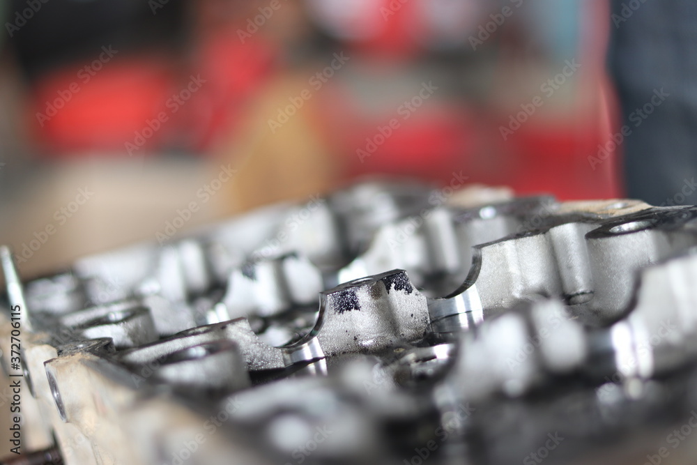 The mechanic is checking the engine. The mechanic is checking the engine.