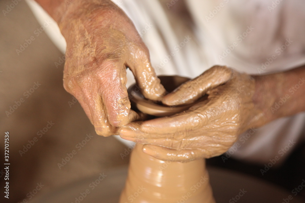 Fototapeta premium hands of old potter