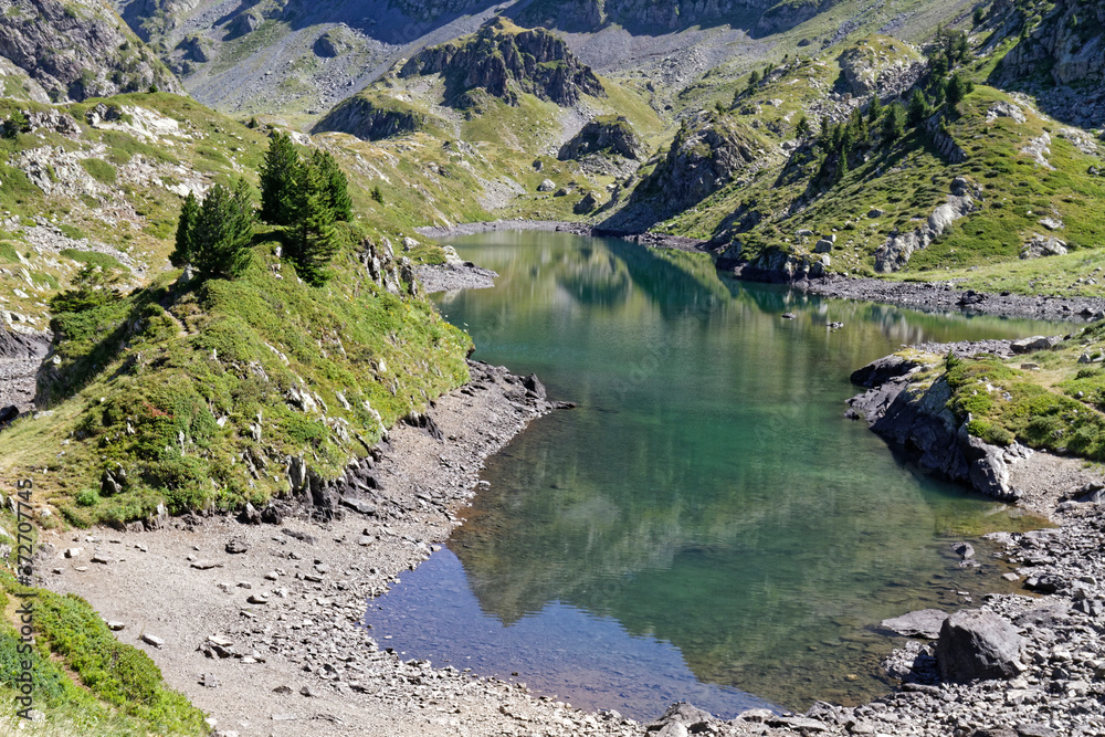The green mountain lake know as Lac Longet between hills