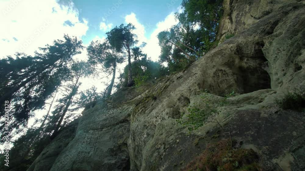 the Cliff of Sietiniezis Rock, Latvia. Gauja National Park. Pine Forest Tourist Trail With Pathwalk Near Sandstone Cliffs. the Cliff of Sietiniezis Rock, Latvia. Gauja National Park. Pine Forest Tourist Trail With Pathwalk Near Sandstone Cliffs.